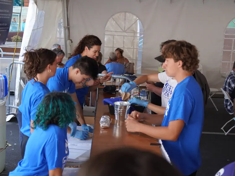 Young volunteers working the serving line